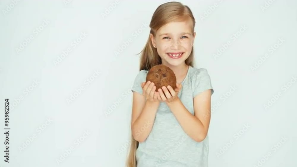 Girl playing with coconut and laughing at camera Girl playing with coconut and laughing at camera
