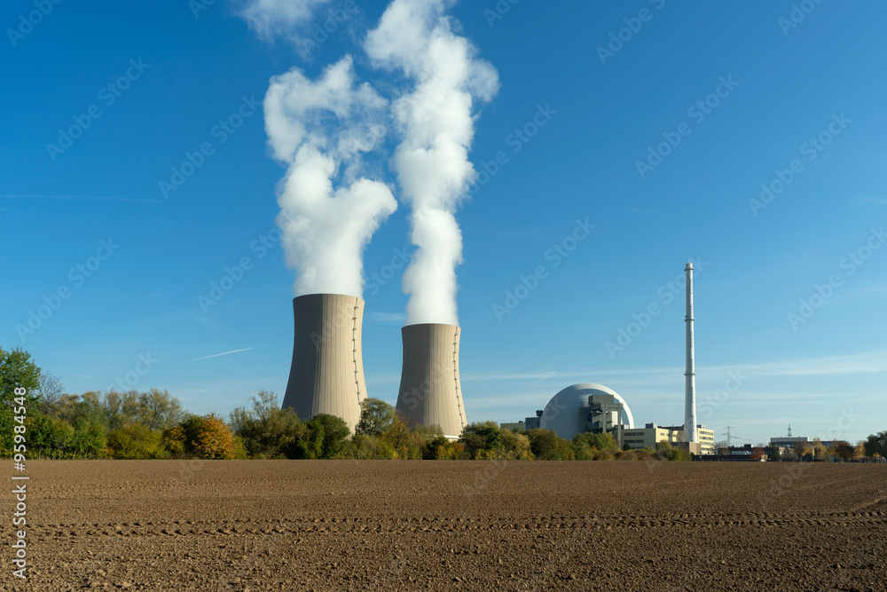 Nuclear power plant on sky background in sunlight