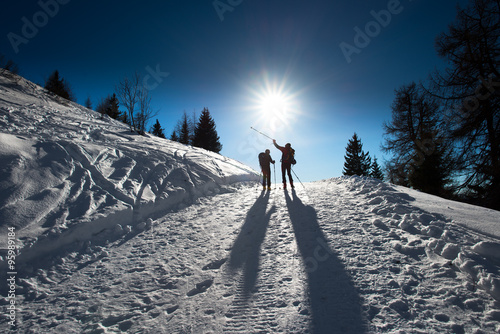 Alpine skiers uphill