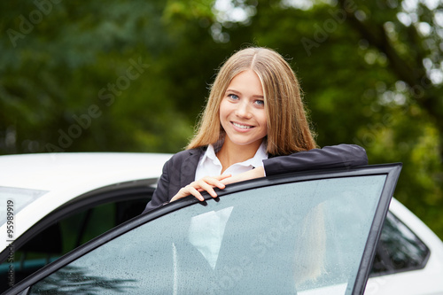 Woman leaning on car door