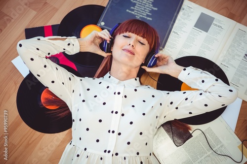 Hipster woman with closed eyes and headphones 