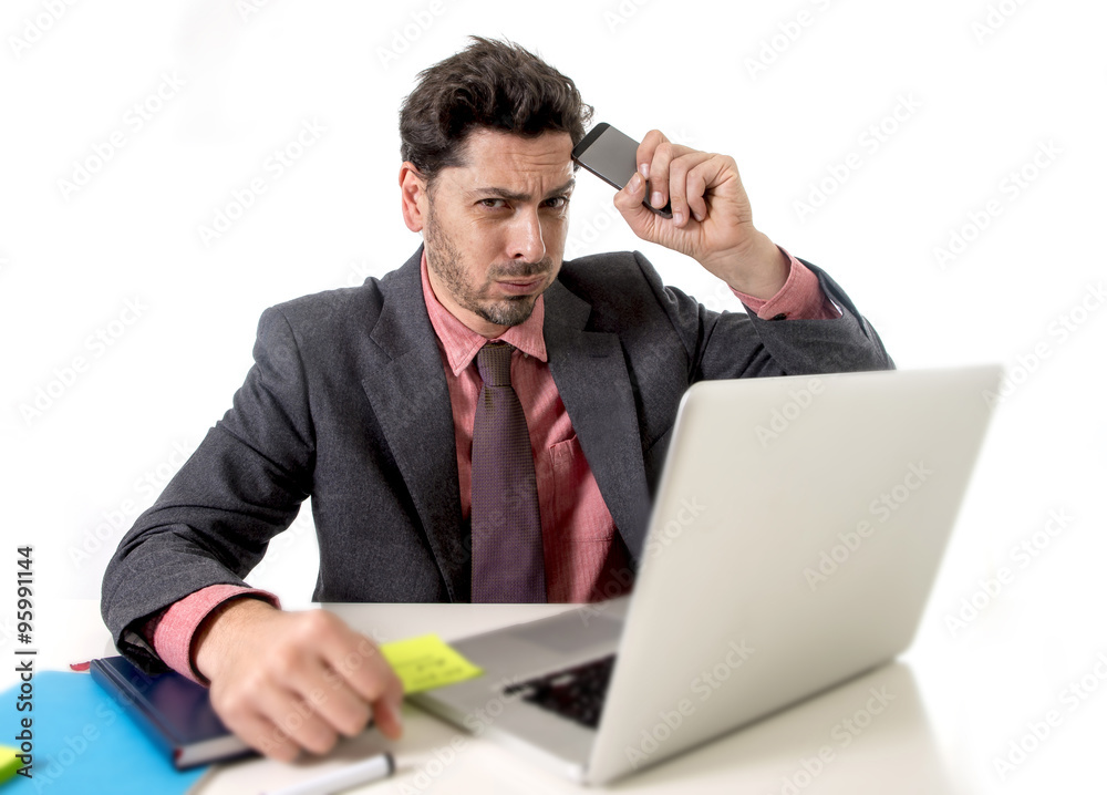 businessman at office working stressed on computer holding mobile phone businessman at office working stressed on computer holding mobile phone