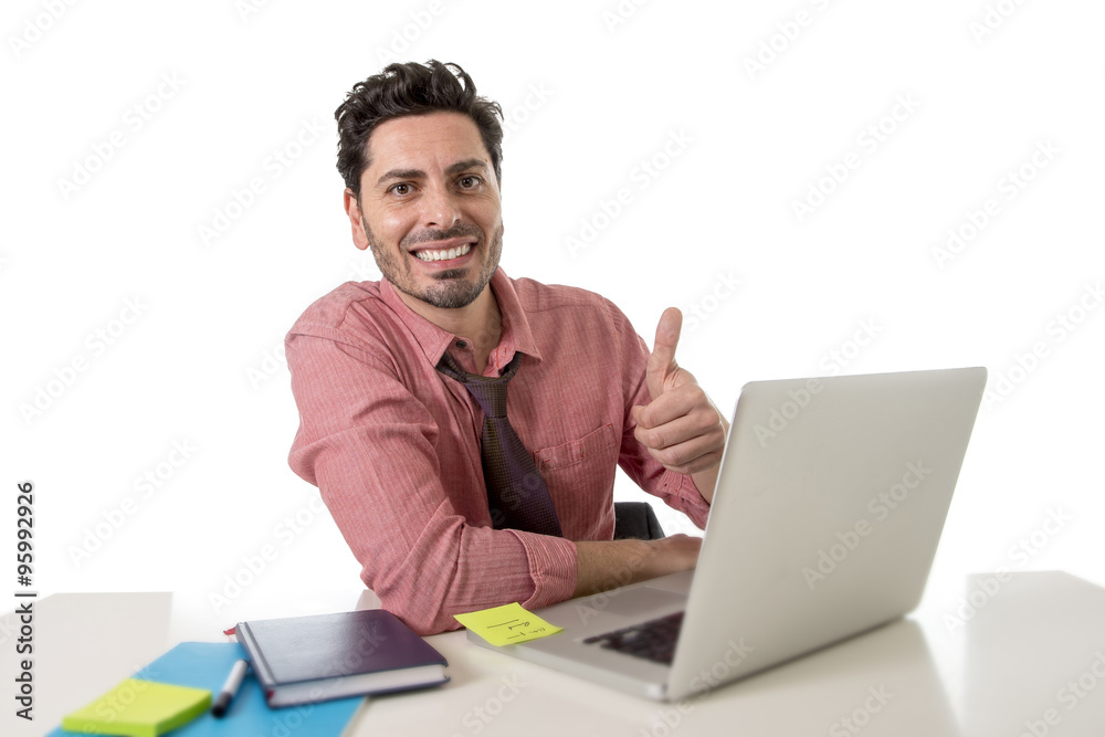 attractive businessman in shirt and tie sitting at office desk working with computer laptop giving thumb up attractive businessman in shirt and tie sitting at office desk working with computer laptop giving thumb up