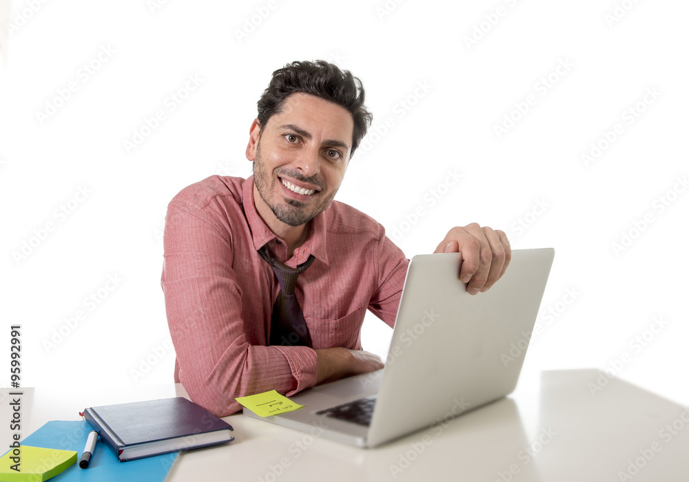 happy attractive businessman in shirt and tie at office desk working with computer smiling happy attractive businessman in shirt and tie at office desk working with computer smiling