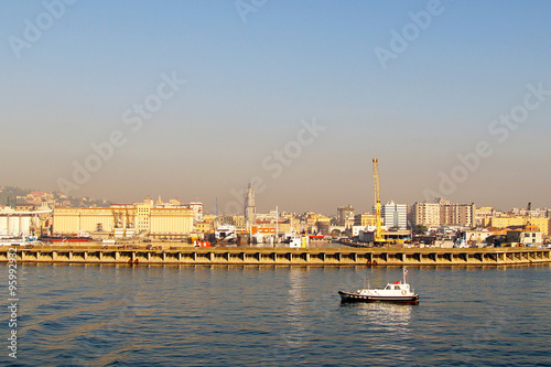 Morning view of harbor of Naples. Pollution and smog alert over the city.