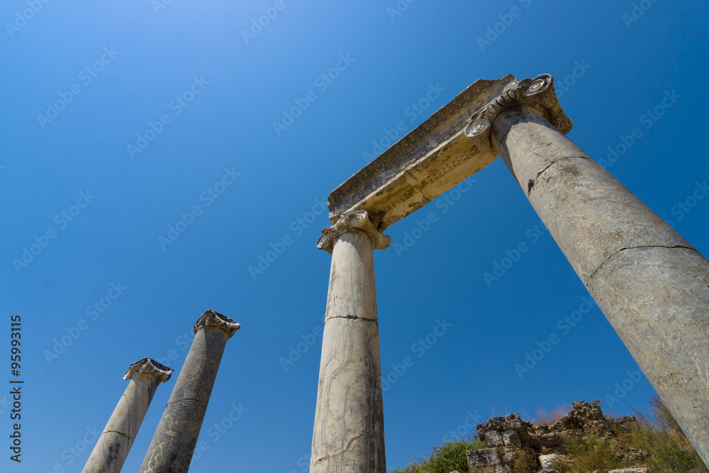 Ancient ruins of Perge on a background of blue sky. Turkey.