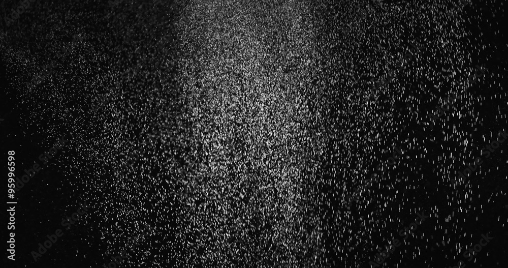 Fine dust particles falling from above creating dense atmosphere Fine dust particles falling from above creating dense atmosphere
