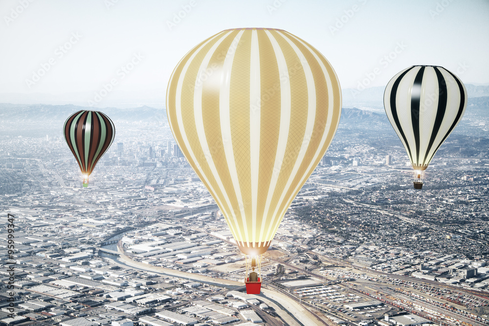 Naklejka premium Flying baloons in the sky of megapolis city