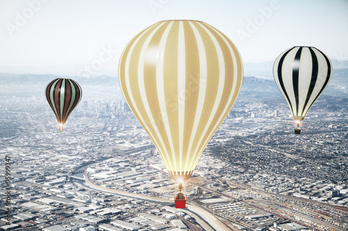 Flying baloons in the sky of megapolis city