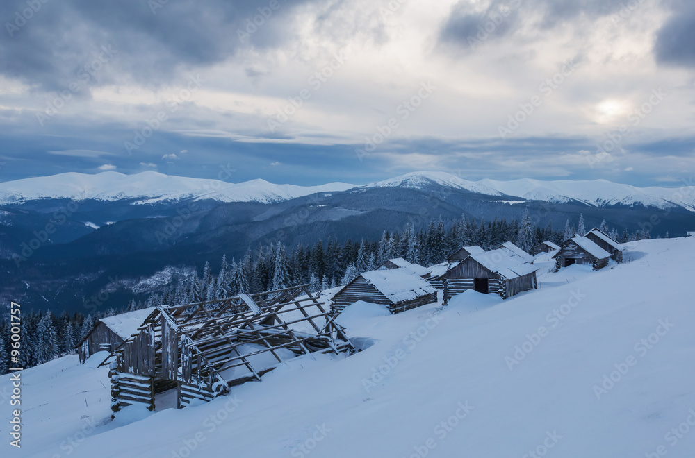 Fototapeta premium abandoned cabins on the snow