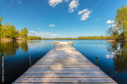 Wooden jetty on a sunny day in Sweden