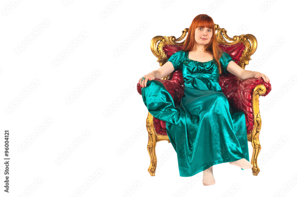 Girl sitting on antique armchair
