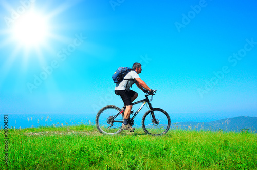 Cyclist rides a bicycle