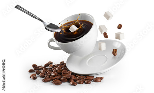Cup of coffee with coffee beans and sugar on a white background. #96004902