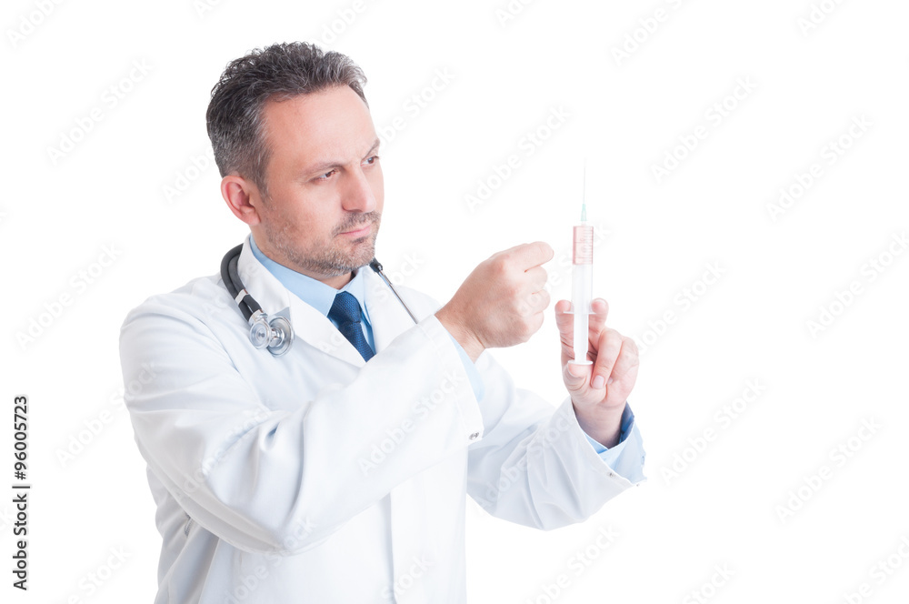 Doctor or medic preparing and tapping syringe