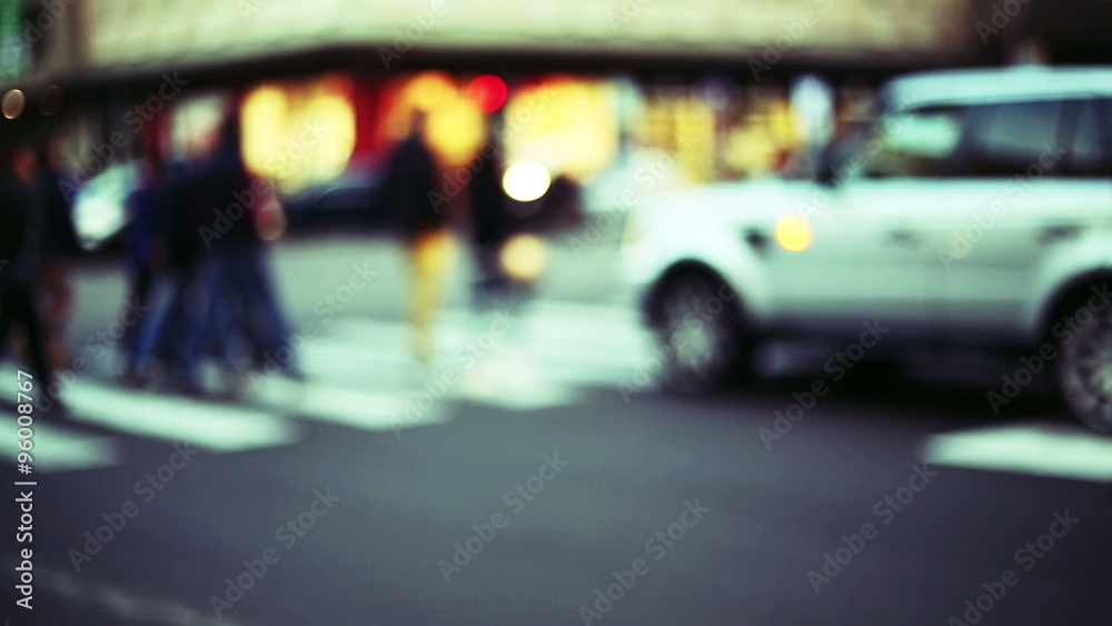anonymous crowd cross the street into the traffic, blurred and out of focus context anonymous crowd cross the street into the traffic, blurred and out of focus context
