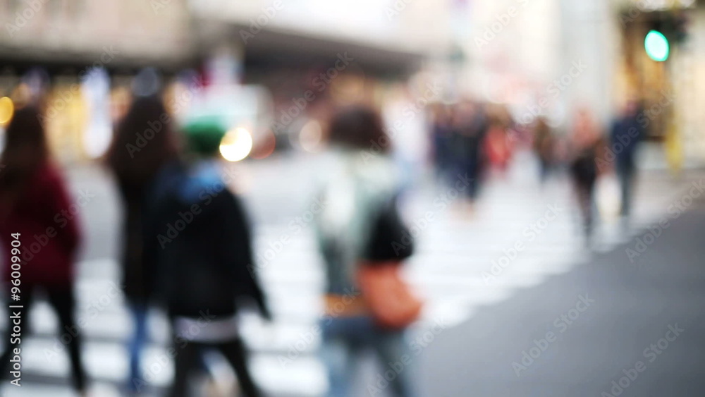 anonymous crowd cross the street in urban context blurred and out of focus anonymous crowd cross the street in urban context blurred and out of focus