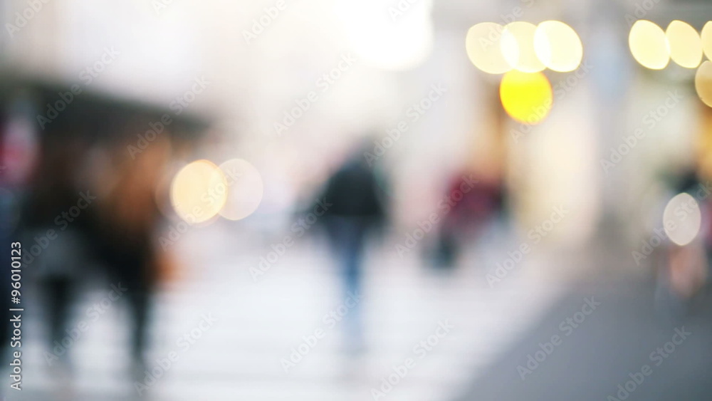 anonymous people crossing the street in a out of focus and blurred background anonymous people crossing the street in a out of focus and blurred background