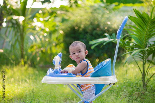Asian baby in the baby walker © pookpiik
