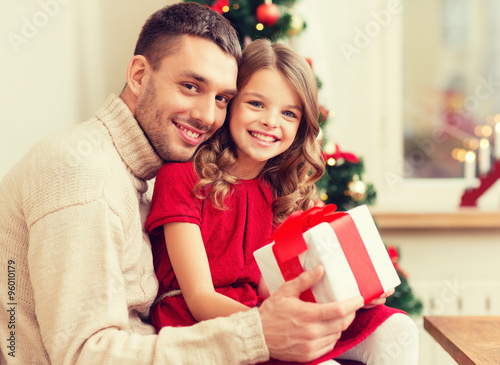 Wallpaper Mural smiling father and daughter holding gift box Torontodigital.ca