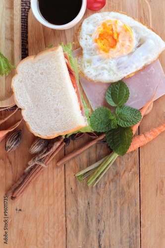 Slice bread ,ham ,fried eggs with breakfast.