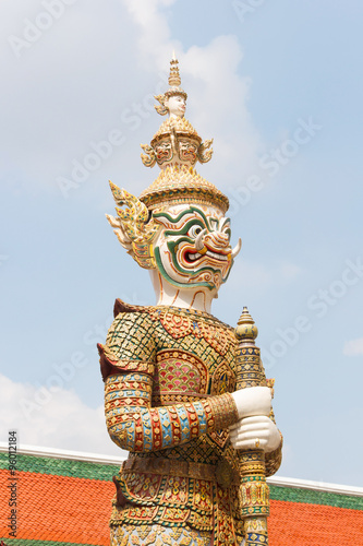 White Thai giant demon Yaksha statue at Wat Phra Kaew temple in Bangkok Thailand.