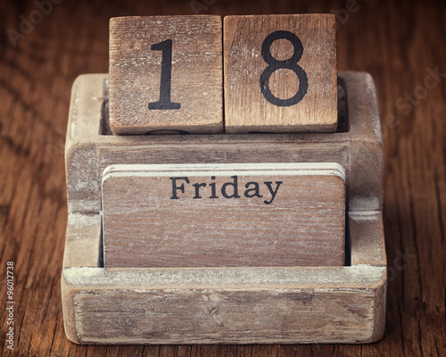 Photography Grunge calendar showing Friday the eighteenth on wood background