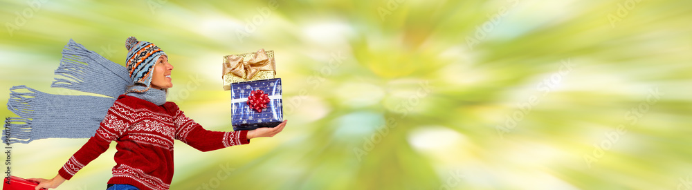 Obraz premium Happy Christmas woman with gifts.