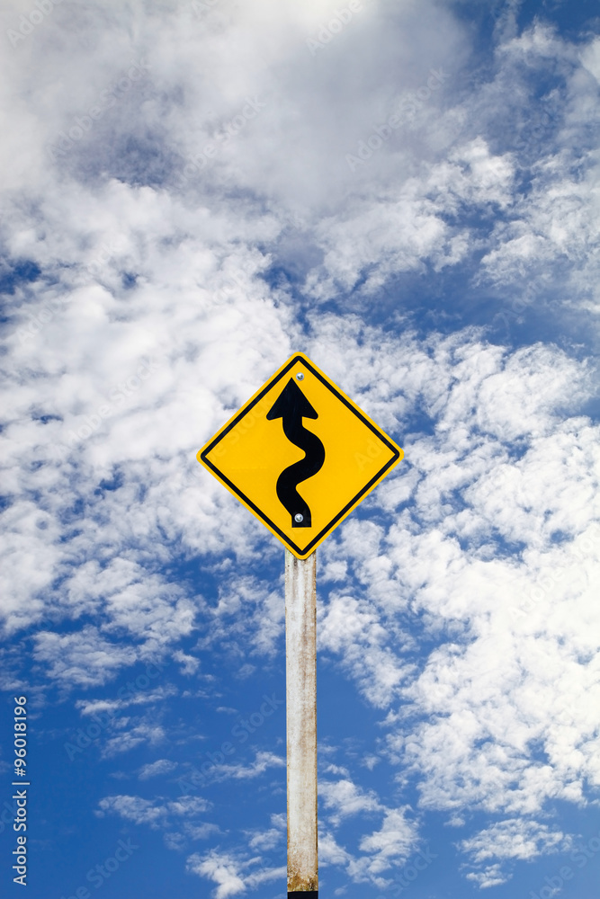 Curvy Road Sign on blue sky background with clipping path. Curvy Road Sign on blue sky background with clipping path.