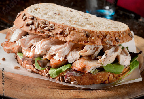 Chicken, turkey sandwich freshly made from Thanksgiving, Christmas leftovers on wholemeal bread.