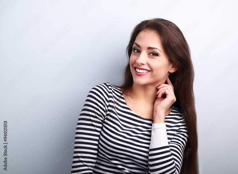 Happy smiling young casual woman with long hair looking Happy smiling young casual woman with long hair looking