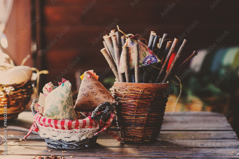 rustic easter decorations on wooden table in cozy country house