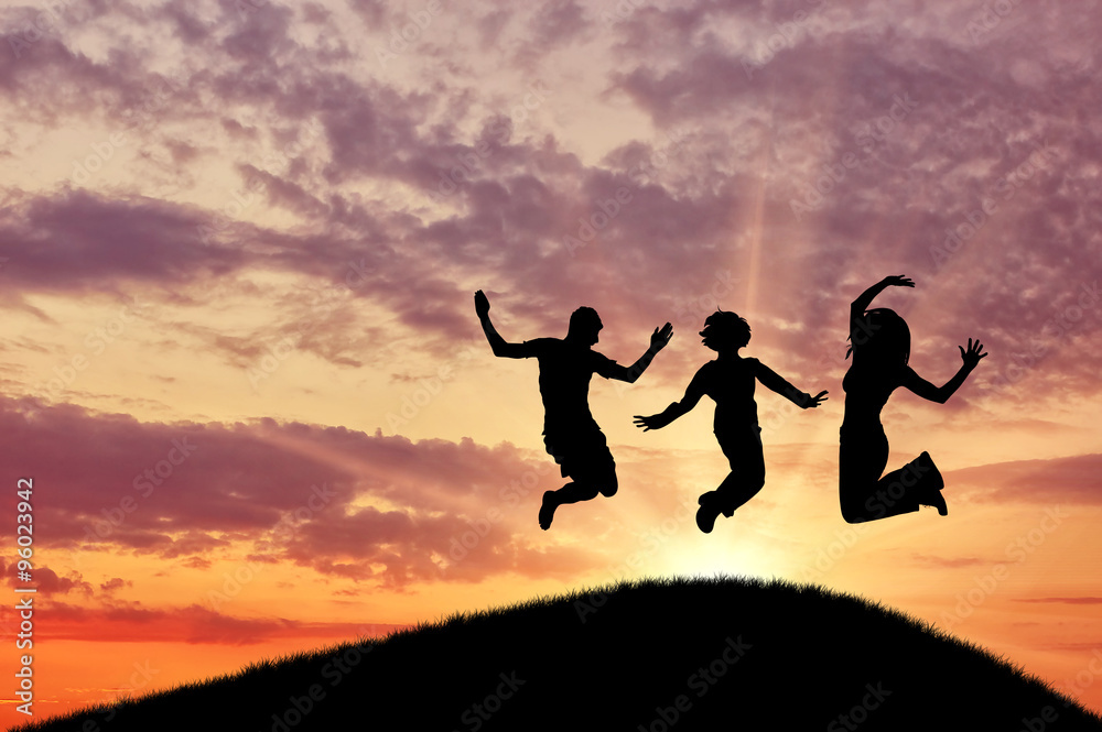  Silhouette of a happy group of people jumping