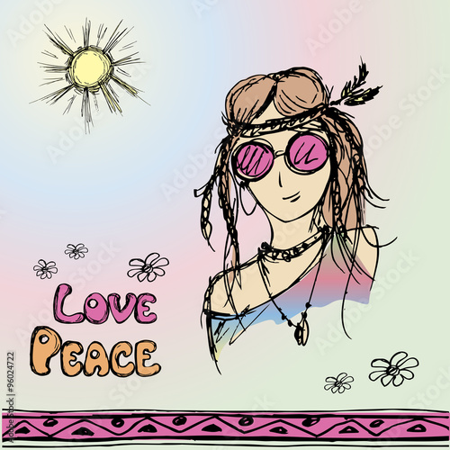 Friendly hippie with long hair making peace sign photo