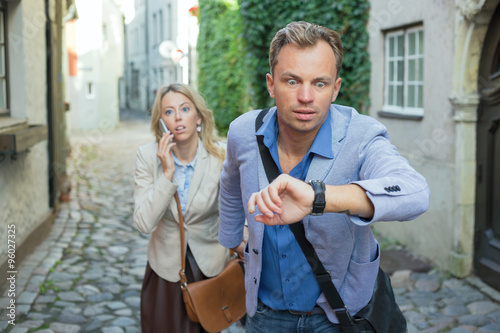 Фотография Man in a hurry looking at his watch