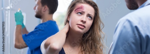 Woman with cut on forehead photo