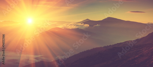 Slika na platnu Panoramic view of mountains, autumn landscape with foggy hills at sunrise