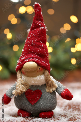 Christmas composition with textile gnome. Winter. New Year. Abstract light background.Selective focus.