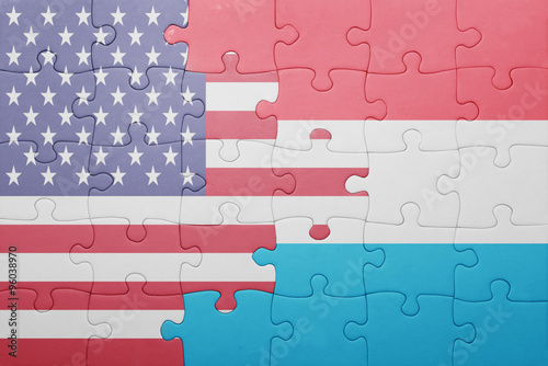 puzzle with the national flag of united states of america and luxembourg