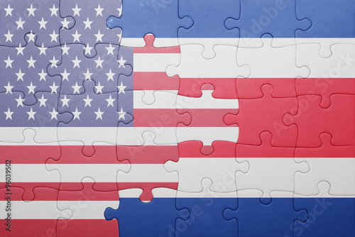 puzzle with the national flag of united states of america and costa rica