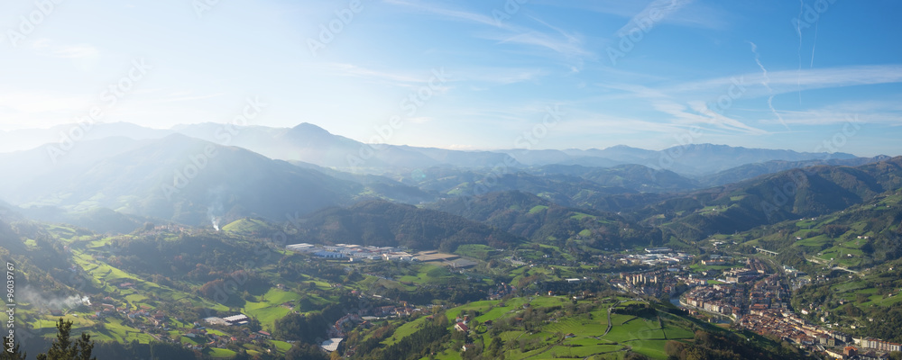 Meadows and mountains houses with the city of Tolosa, Euskadi.