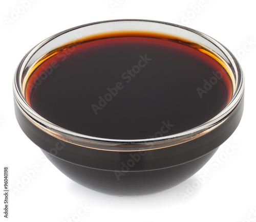 Soy sauce in small glass bowl isolate