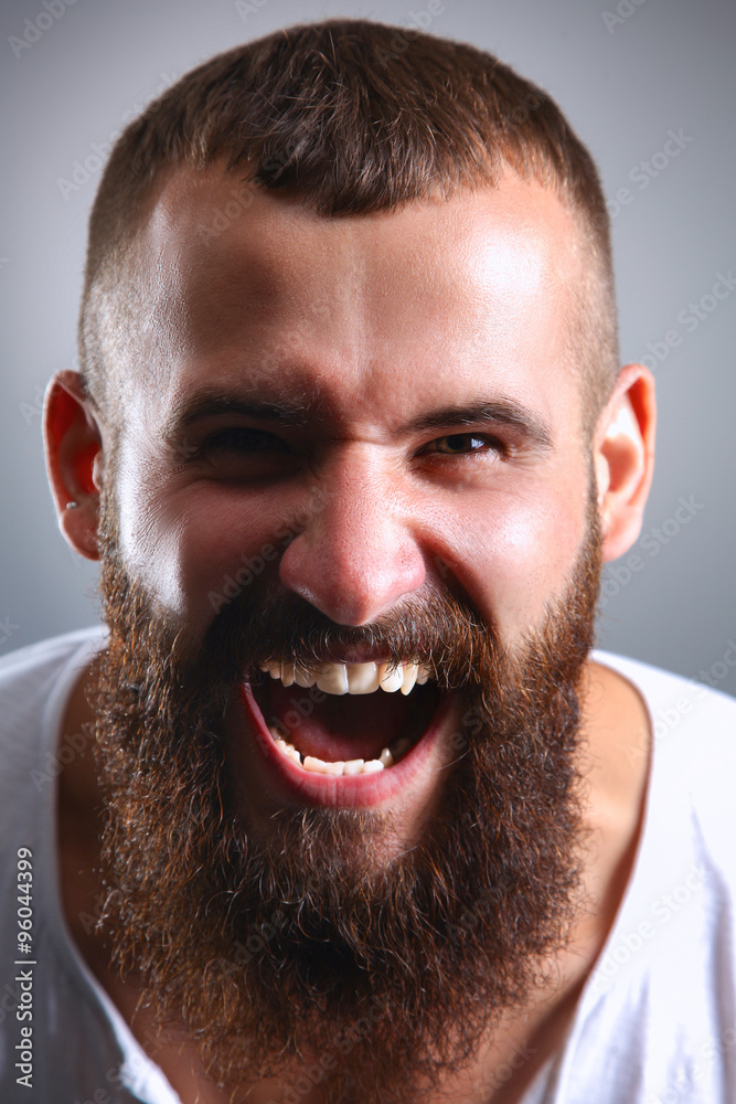 Portrait of handsome man standing, isolated on grey background Portrait of handsome man standing, isolated on grey background