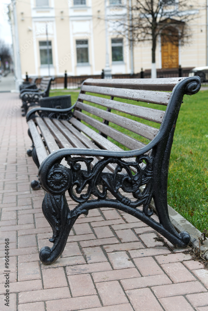 benches on a city street in autumn