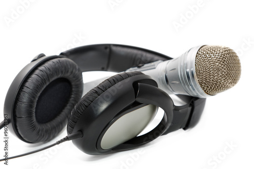 Microphone and ear-phones on a white background