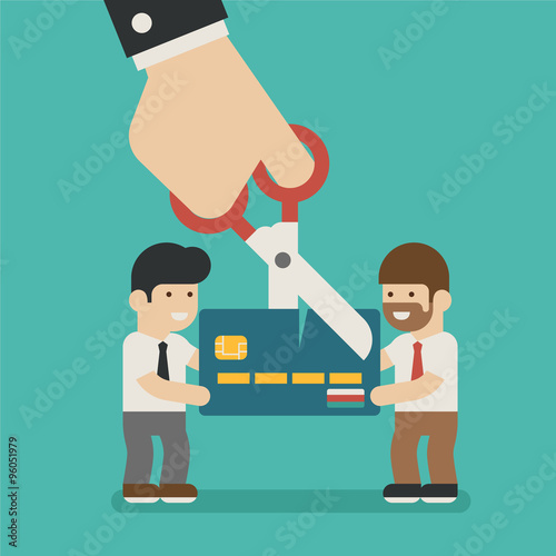 Hands cutting a credit card