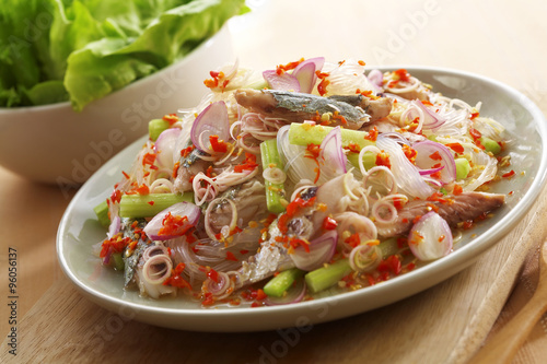 close up thai spicy seafood salad in ceramic dish