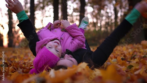 Mom is hugging her little daughter
