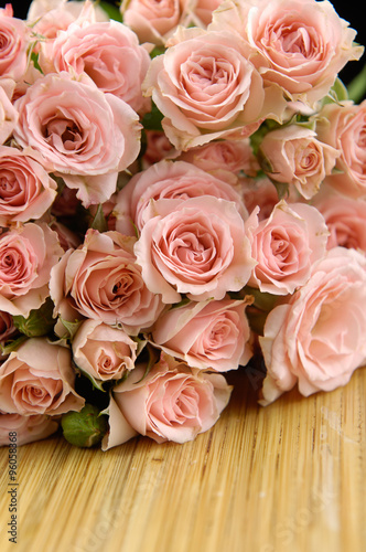 bouquet orange rose on wooden background     © camellias