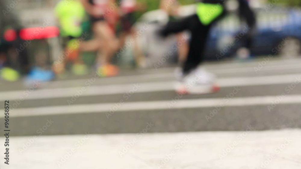 marathon runners legs running on city road